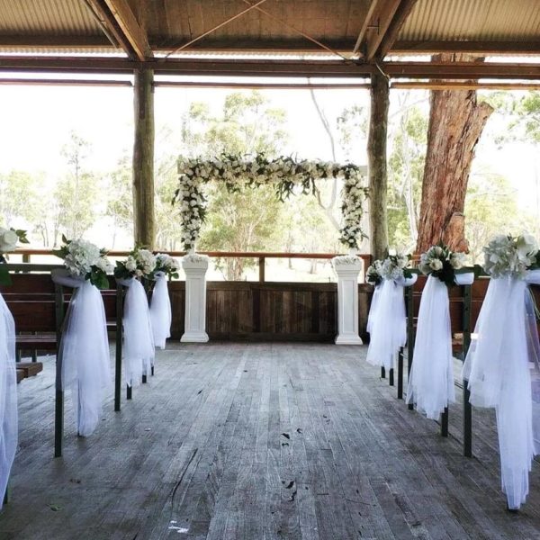White arch with native florals